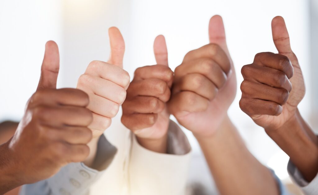 Thumbs up, diversity and people with success in the office for team building, collaboration or team
